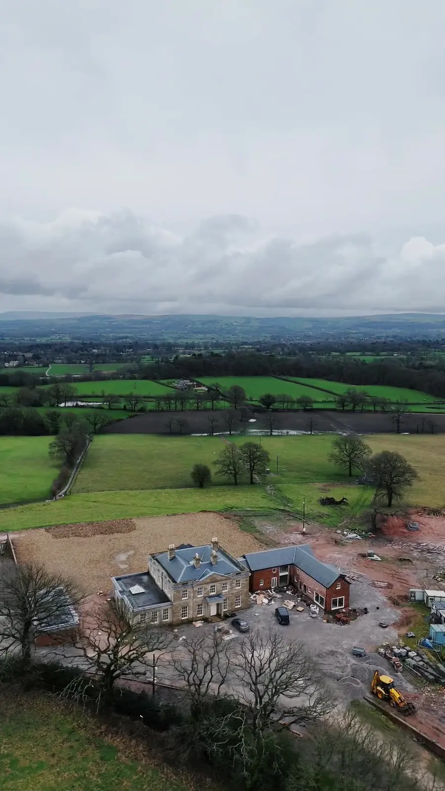 Drone view of a large house during renovation in Alderley Edge